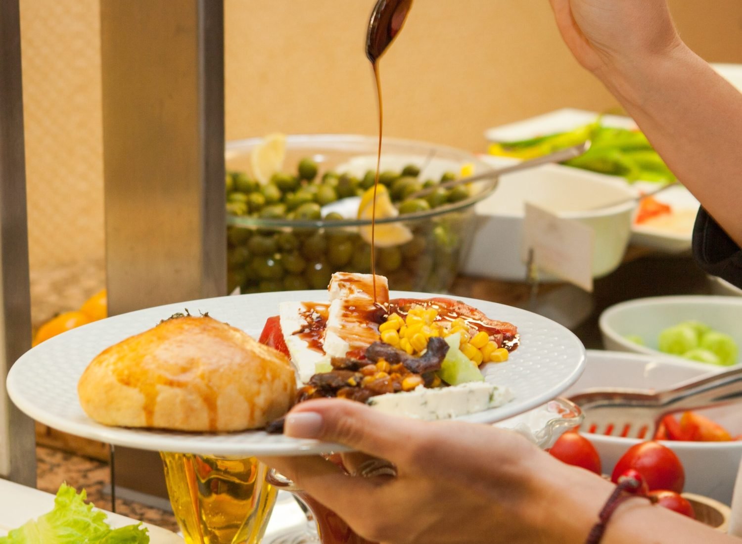 Woman preparing delicious meal in a kitchen . side view.