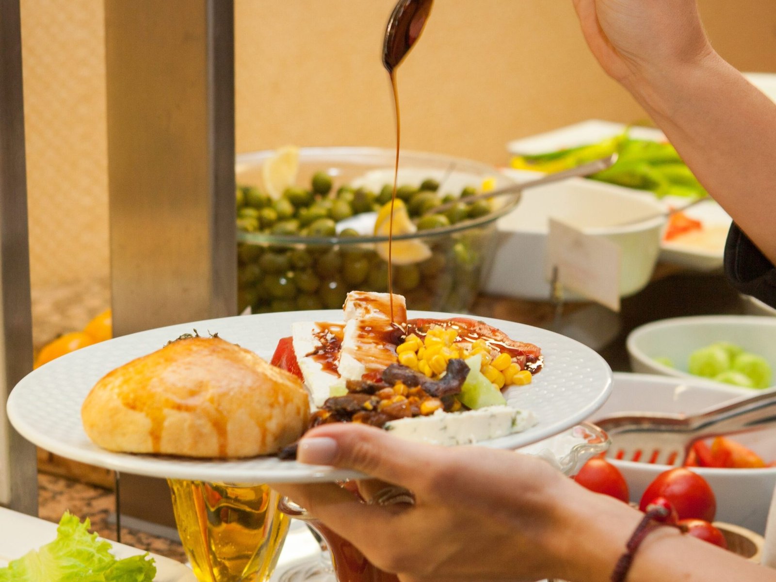 Woman preparing delicious meal in a kitchen . side view.